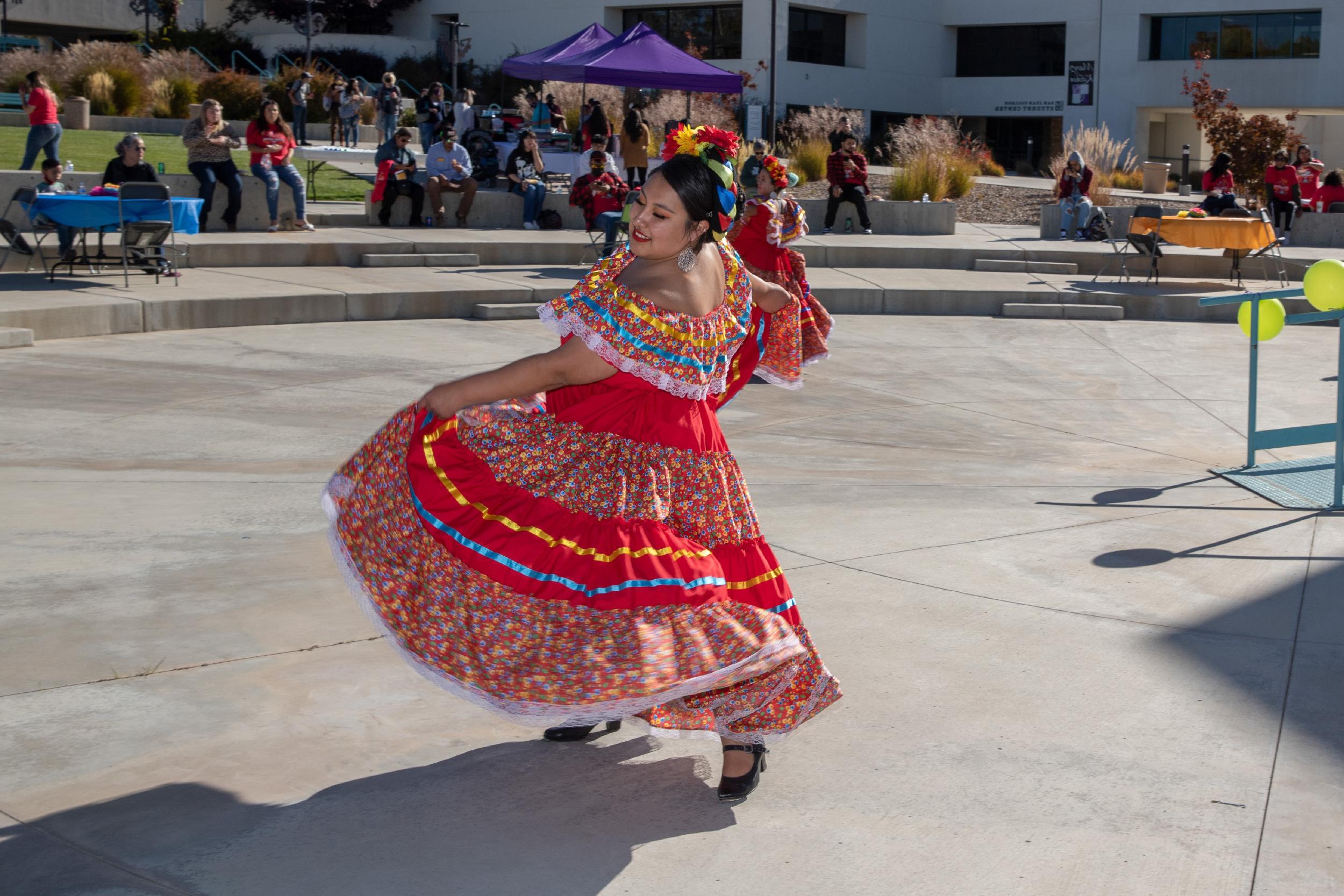 A women dancing in her tradition Hispanic attire