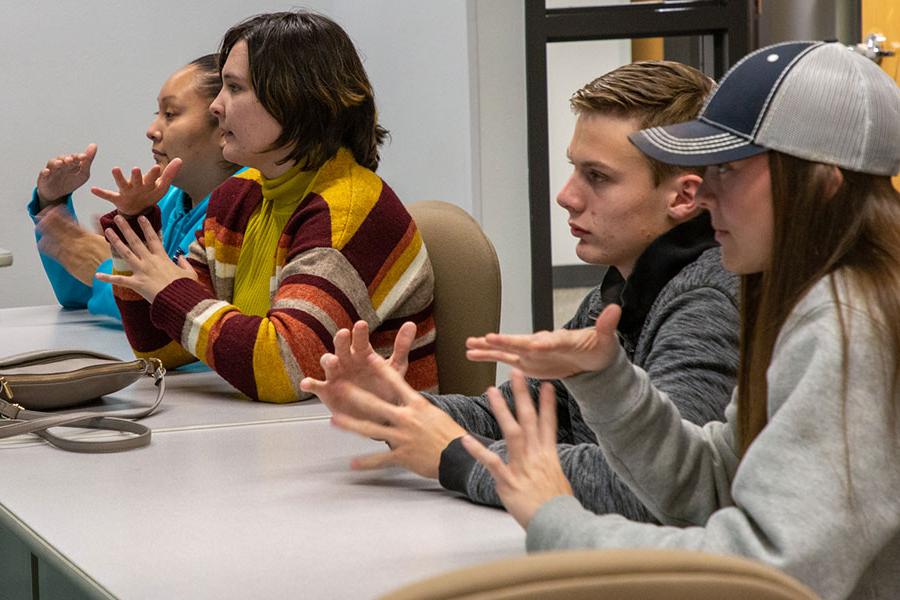 火博体育 students practicing American Sign Language hand signs in class